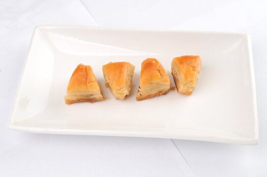 Four Pieces of Baklava Served on a White Plate