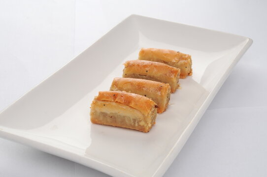 Four Pieces of Baklava Served on a White Plate