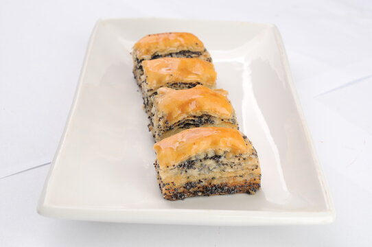 Four Pieces of Baklava on a White Plate