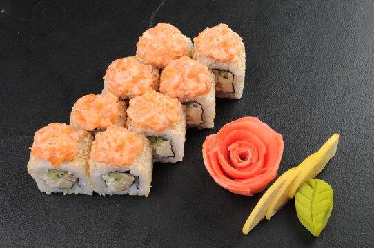 Sushi Rolls with Ginger and Wasabi on Dark Stone Surface