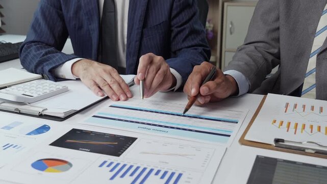 Business team analyzing financial data and marketing strategy