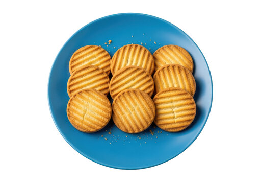 Fresh baked round butter cookies on a bright blue plate isolated with biscuits