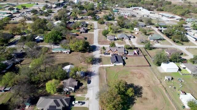 Aerial flight over houses in Boyd, Texas flying west over W Morton Ave.