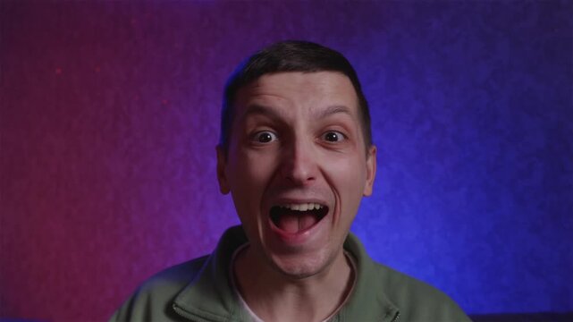 Emotional sports fan shouting Let's Go and cheering