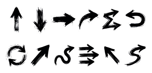 Fototapeta premium Collection of twelve black hand-drawn grunge arrows with various shapes and directions, isolated on a clean white background