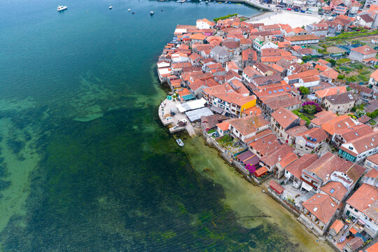 Aerial Drone View of the Coastline and Traditional Stone Horreos in the Historic Village of Combarro Galicia