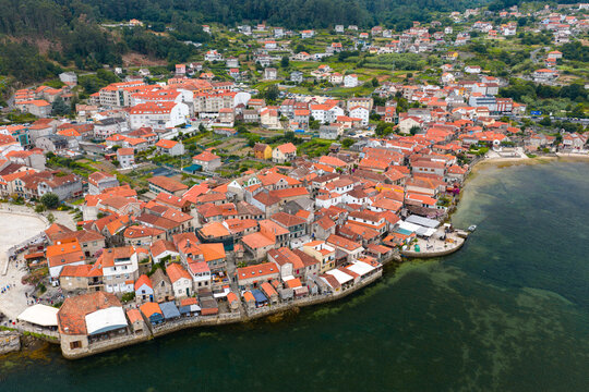 Aerial Drone View of the Coastline and Traditional Stone Horreos in the Historic Village of Combarro Galicia