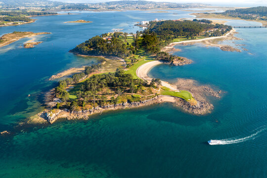 Aerial View of the Golf Course on Illa da Toxa and the Sandy Coastline of Illa de Arousa at Sunset Galicia