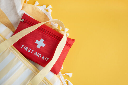 First aid kit in beach bag for summer travel