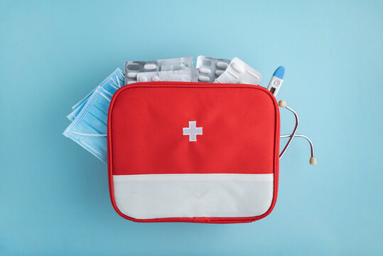 Red first aid kit with medical supplies