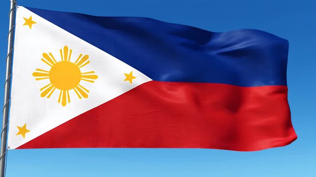 Waving flag of the Philippines with sun and stars against a clear blue sky, national symbol, patriotism