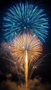 Vibrant fireworks exploding in a colorful night sky during a celebratory event with dramatic light and smoke effects