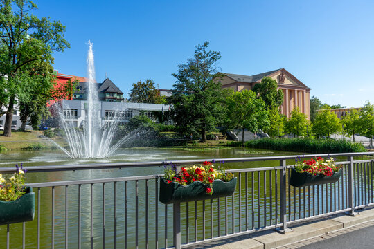 fountain in the park with Kulturhaus at Platz der Deutschen Einheit in Suhl, Thuringia, Germany