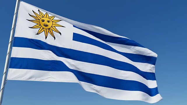 Uruguay national flag waving in blue sky, national symbol, patriotism, country, blue and white stripes, sun emblem