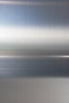 Brushed metal texture background vertical ribbed metallic surface