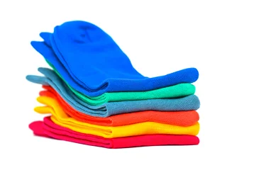 Stack of colours unisex socks isolated on white background, space for text © Savvapanf Photo ©