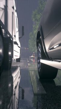 Vertical QHD Rainy City Driving Low Angle Truck Overtaking 60p CGI Video. 9:16 portrait orientation graphic asset featuring intense storm drops, water splashes, puddles, and bright headlight reflectio