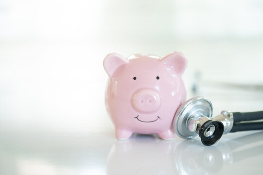 Investment in health insurance and financial planning for health concept. piggy bank and medical stethoscope with copy space.