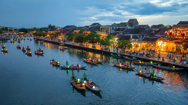 Hoi An ancient town which is a very famous destination for tourists. tourists from Thailand, Korea, America and Japan are relax and experiencing a basket boat tour