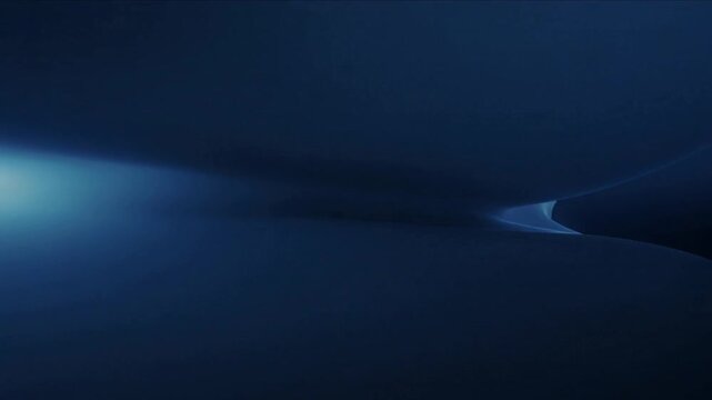 Bright lens flare appearing, curved luminous ridge revealing cool-blue horizon, with moving light