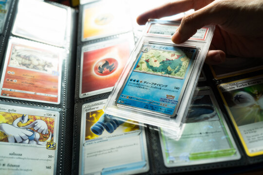 Bangkok, Thailand - July 12, 2026 : Graded Pokemon Trading Card in Protective Slab Held by a Collector Hand.