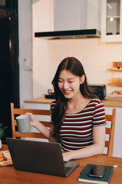 Asian woman using computer remote for business studying, watching online virtual webinar training meeting, video call. asian business woman talking on laptop in home office. Banner, copy space