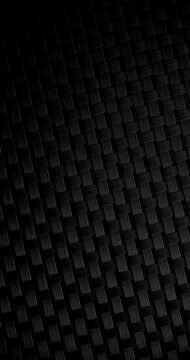 Black woven texture close-up. Dense dark basketweave pattern with repeating geometric structure.