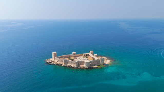 Kizkalesi, Mersin, Turkey. Maiden Castle, a medieval sea fortress with stone ramparts and bastions, aerial view over turquoise Mediterranean waters