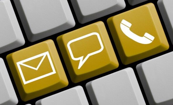 Kontakt online - Icons auf gelber Computer Tastatur