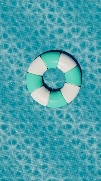 Lifebuoy floating in a clear swimming pool. 3d rendering