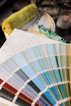 Choosing colors for home renovation with paint swatches