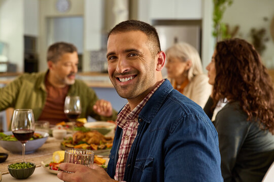 Happy mid adult man at lunch with his family