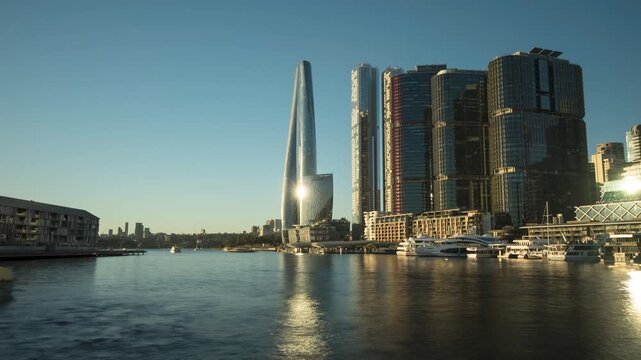 Time lapse of the top of Darling Harbour where it meets Sydney Harbour. The skyscrapers of Barangaroo in the background and boats moving in the foreground.