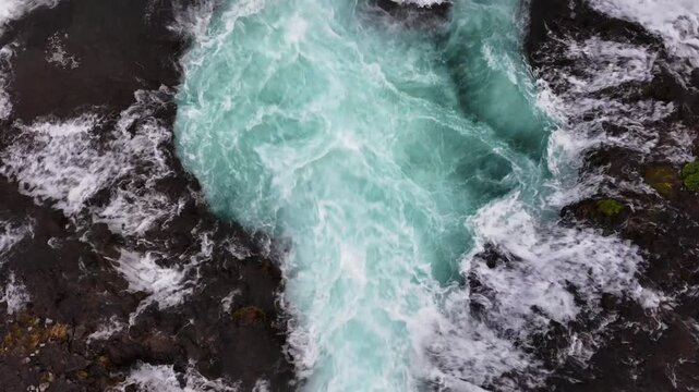 Top-down drone on Bruarfoss turquoise vortex abstract b-roll for title sequences, the Southern Region, Iceland