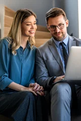Two happy diverse multiethnic business team people working, talking in corporate office © NDABCREATIVITY