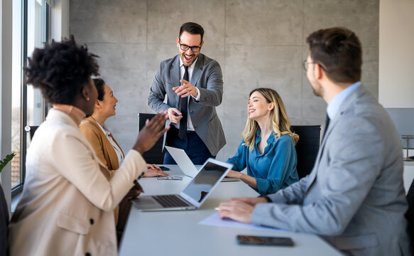 Business colleagues demonstrate teamwork, collaboration, communication, and strategy in office