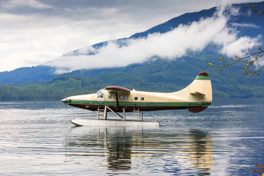 Floatplane on the sea in Alaska. Mountains on a background. USA.