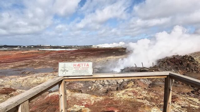 Gunnuhver H&Atilde;&brvbar;tta danger sign at boiling geothermal vent on red sulphuric ground, Reykjanes Peninsula, Iceland