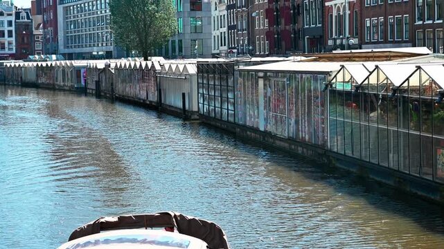 Boat on a beautiful canal in Amsterdam, Netherlands