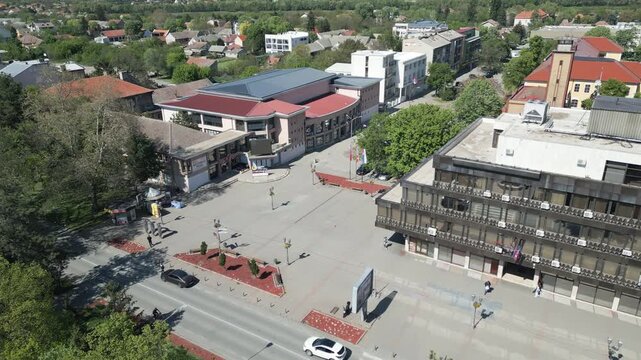 Slow forward drone flight revealing the central town square in Vrbas, Vojvodina, northern Serbia.