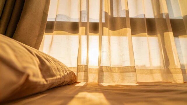 Rising sun shifting sunlight through sheer curtain at bedroom, lighting pillow seam and sheet