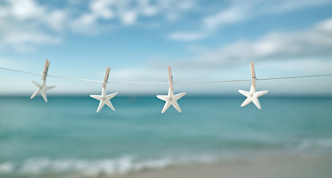Starfish hanging with wooden clothespins against a backdrop of clear skies and a coastal horizon