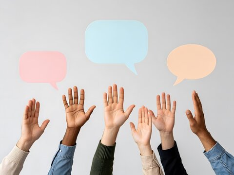 Diverse people raising hands with colorful speech bubbles above