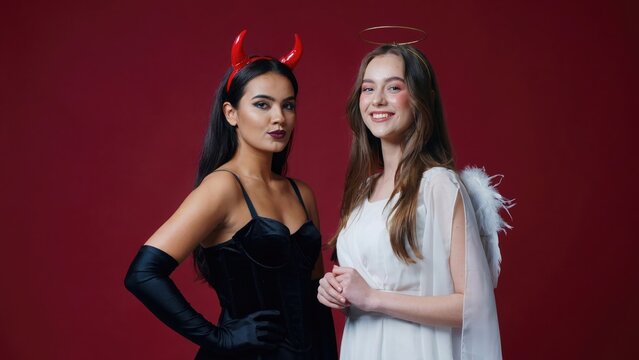 Angel and devil costumes two young women in themed attire
