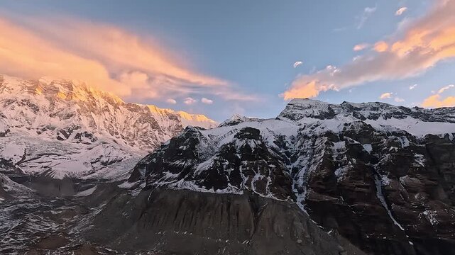 Sunrise pan across the Annapurna massif including Machapuchare from base camp, Nepal