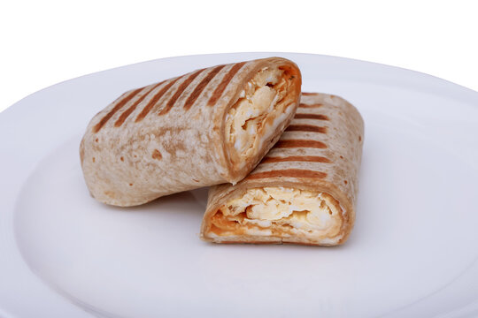 Grilled Egg Tortilla Wrap Cut in Half on White Plate Close Up Isolated on Transparent Background