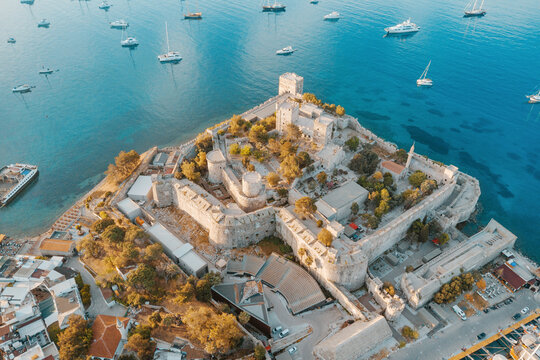 Medieval St. Peter Bodrum castle and museum, standing on a peninsula with sailboats floating in the beautiful blue waters