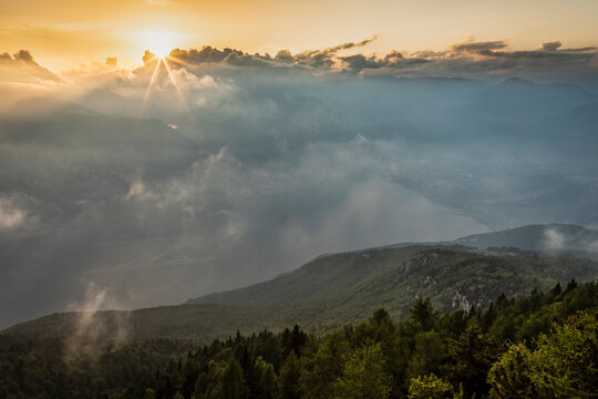 Sunset landscape over Lake Garda offers an inspiring tourism destination for nature exploration in Monte Baldo Natural Park, Brentonico, Trentino, Veneto, Italy.