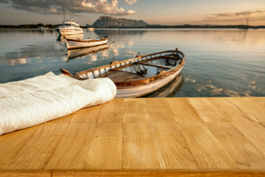 Lake camping with mountain view and copy space &ndash; outdoor summer adventure concept. Boats and natural outdoor setting perfect for travel, camping, lifestyle and adventure-related campaigns, calm water.