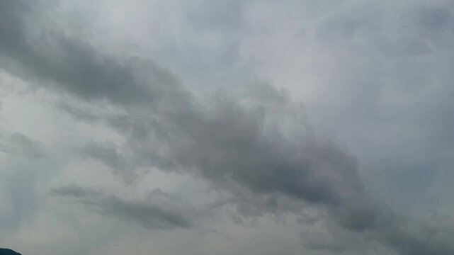 Dramatic sky with swirling gray clouds creating a moody atmosphere in a dynamic natural composition